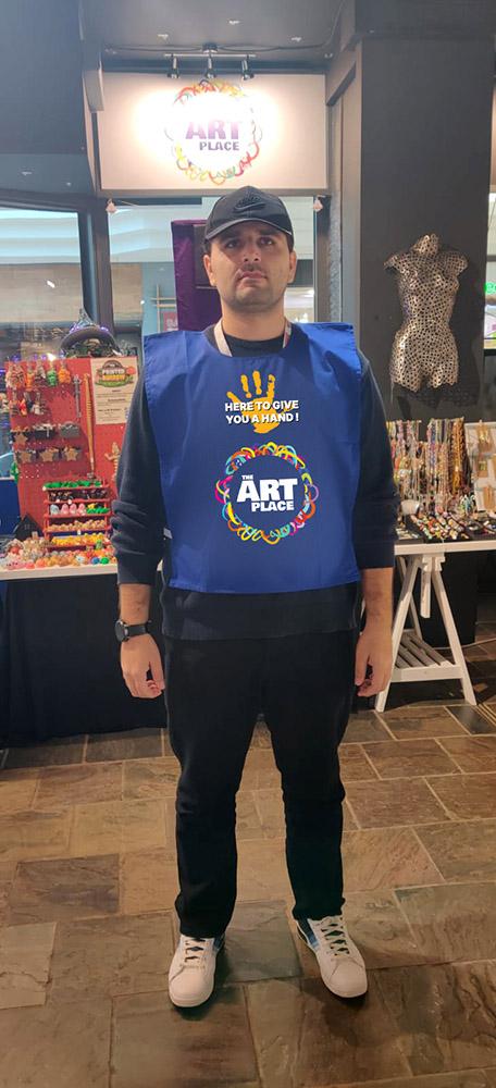 Volunteer shop greeter vest design for the Art Place Charity. Front. 2025.